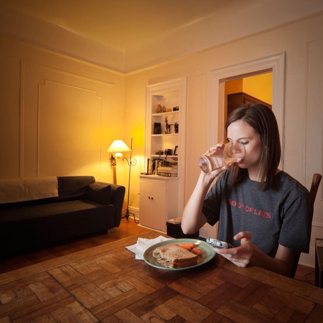 Chelsea Olson, a model, concentrates on her food while reviewing her busy day. Age: 20. Time: 8:13 p.m. Location: Windsor Terrace, Brooklyn.