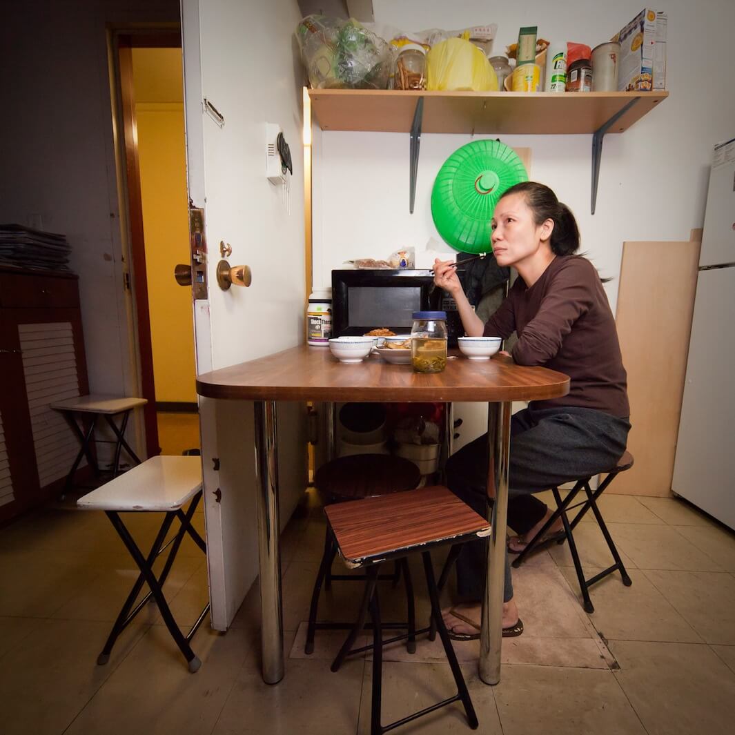 Zheng Yun lives with her daughter and son, but usually eats dinner alone while watching TV. Age: 52. Time: 8:54 p.m. Location: Vinegar Hill, Brooklyn.